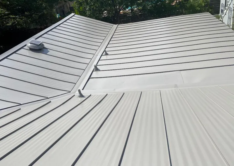 Solar attic fan installed on a metal roof for Roof Ventilation in South Lake Tahoe